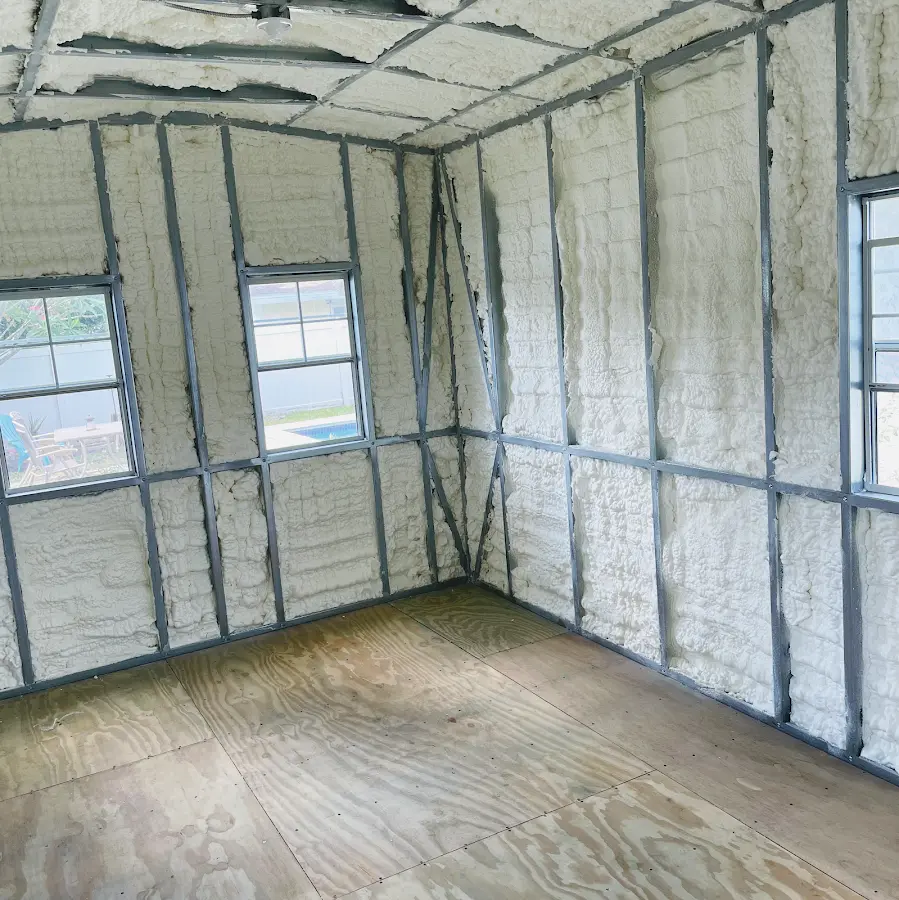 Closed-cell spray foam insulation applied to wall cavities in a residential project in East Haven